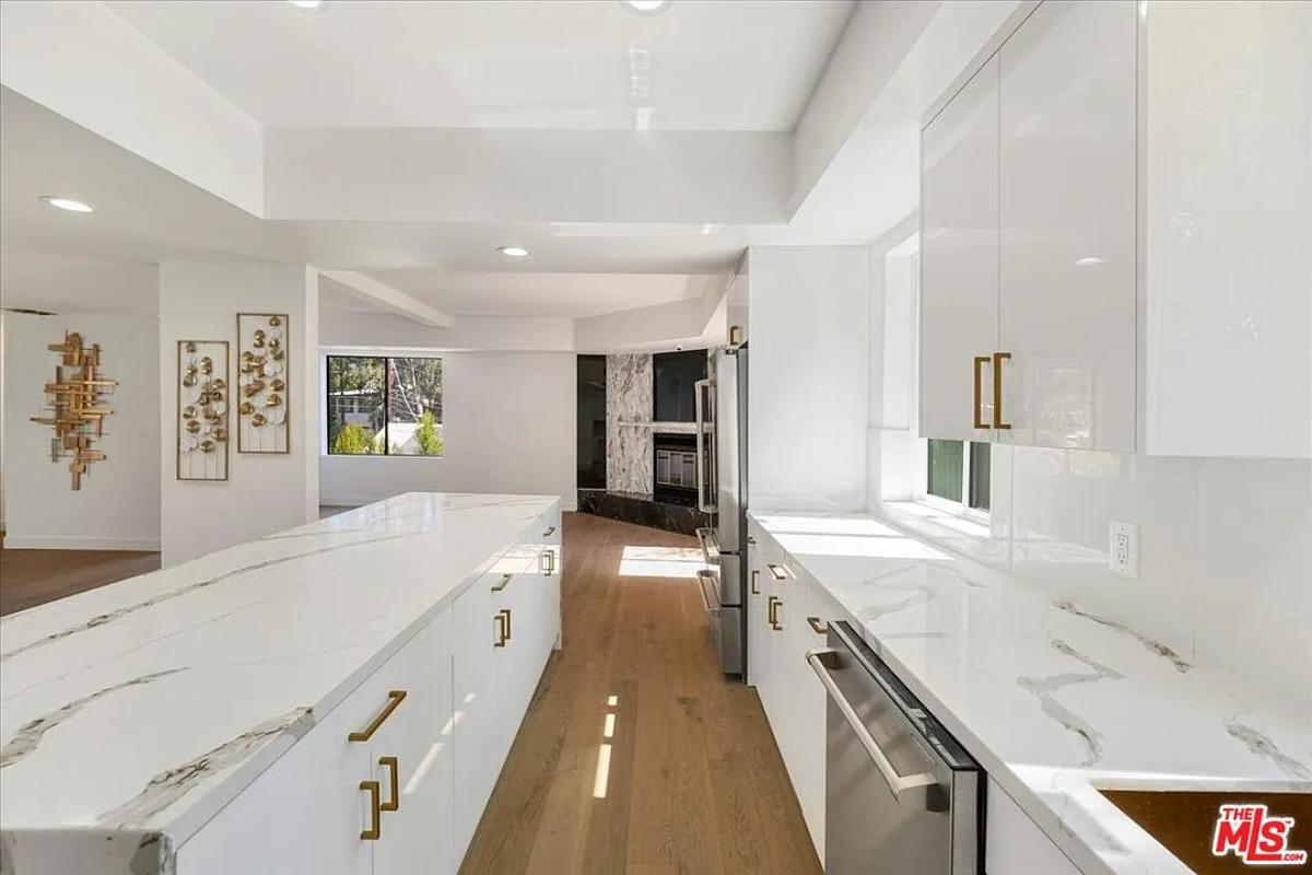 Kitchen with custom cabinetry and an island prep area.