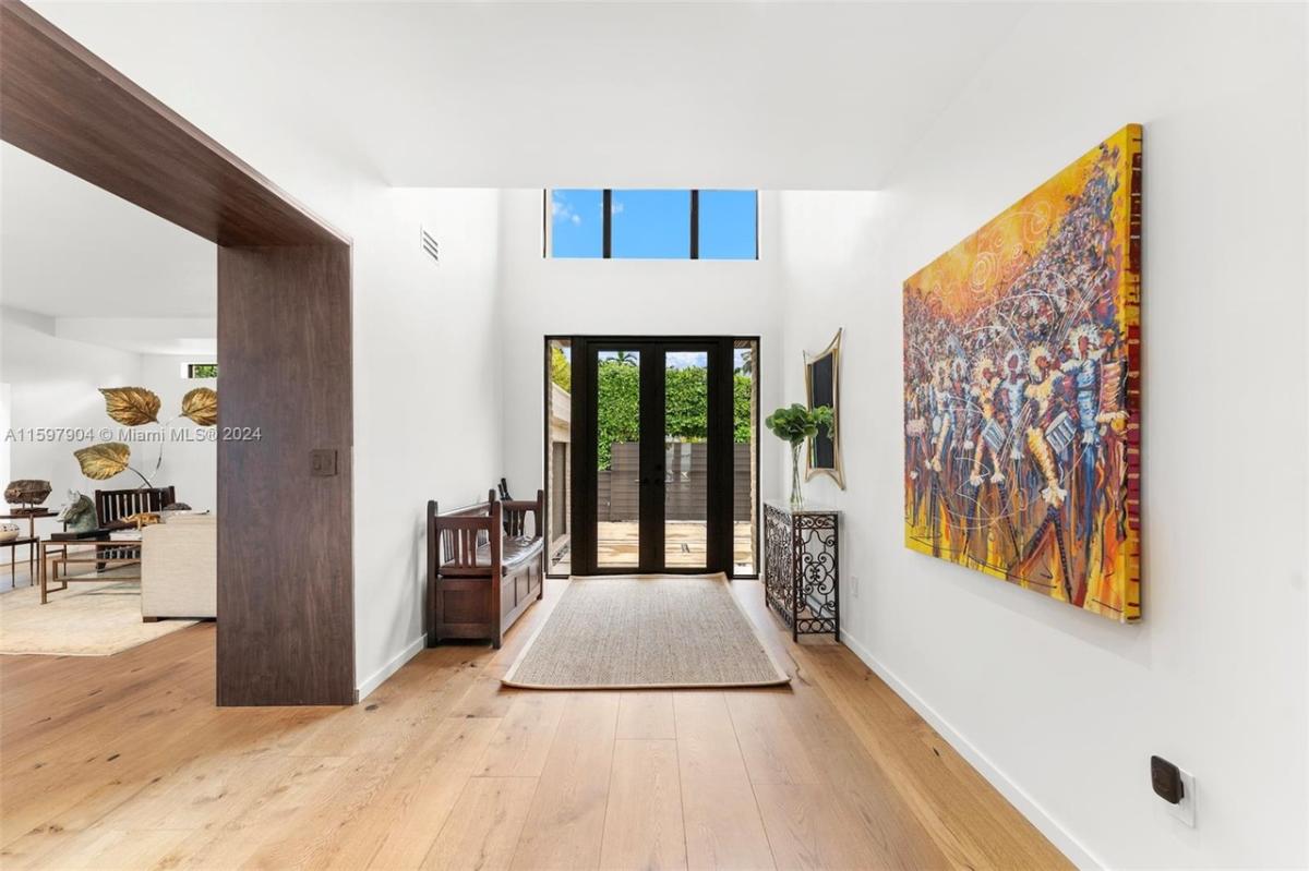 Foyer with soaring double-ceilings.