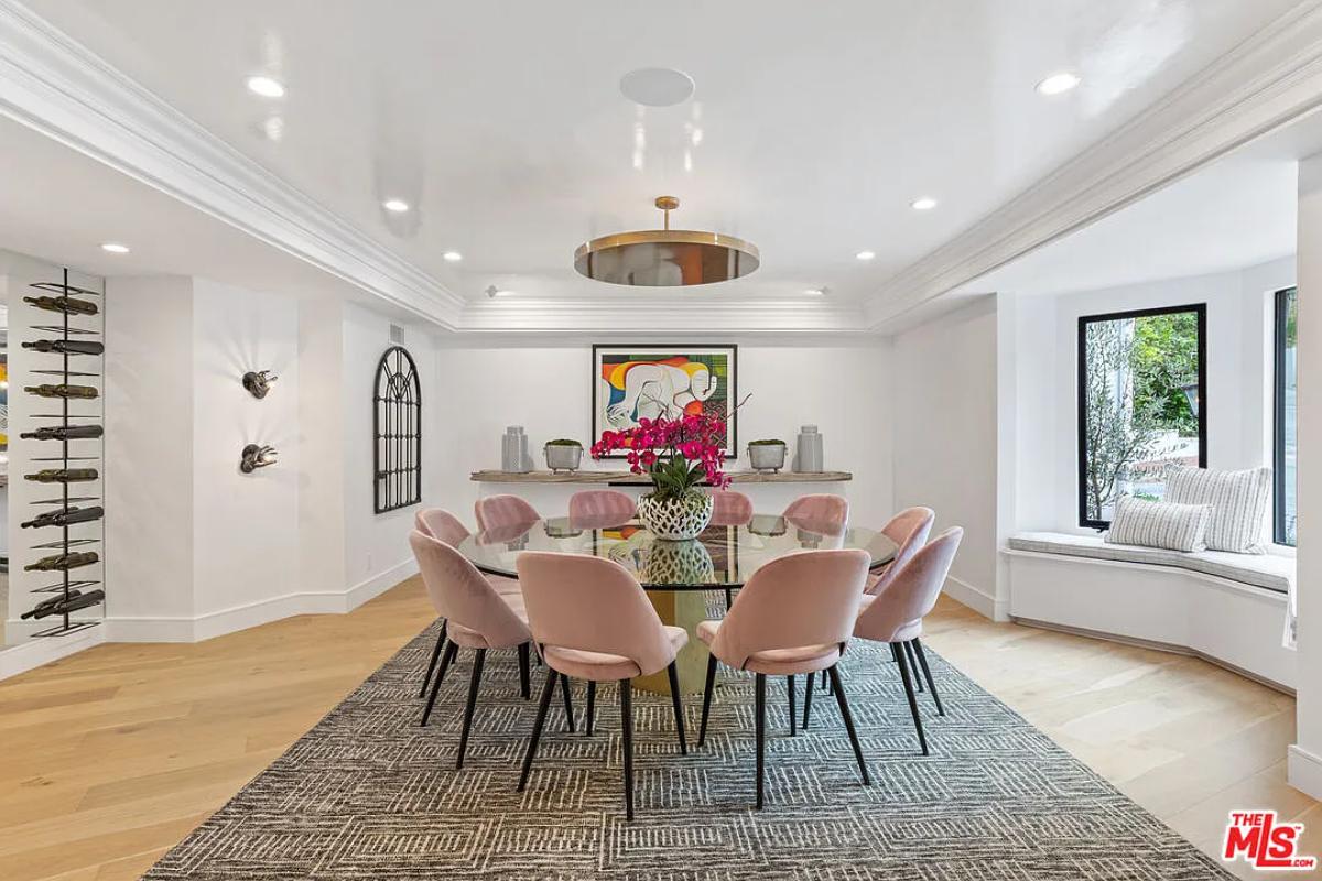 Dining room with a round glass table.