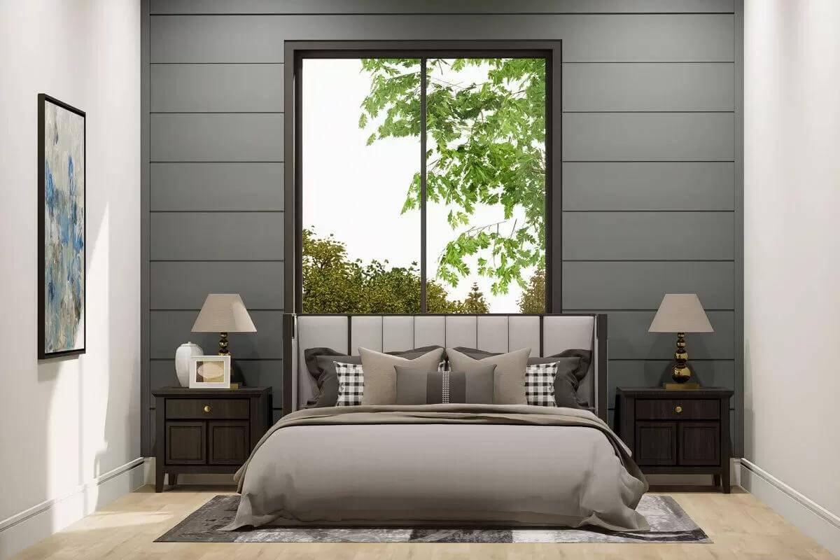 Bedroom with dark wood cabinets and an upholstered bed against the large window.