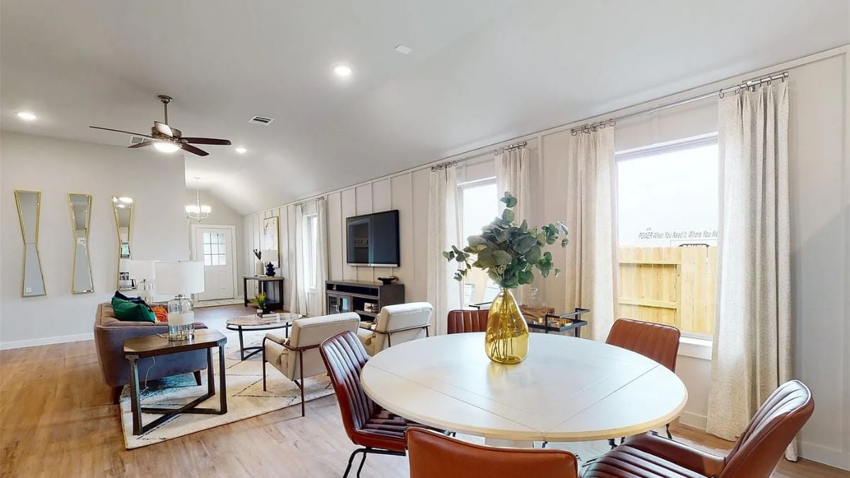 A great room with a living area and dining area.