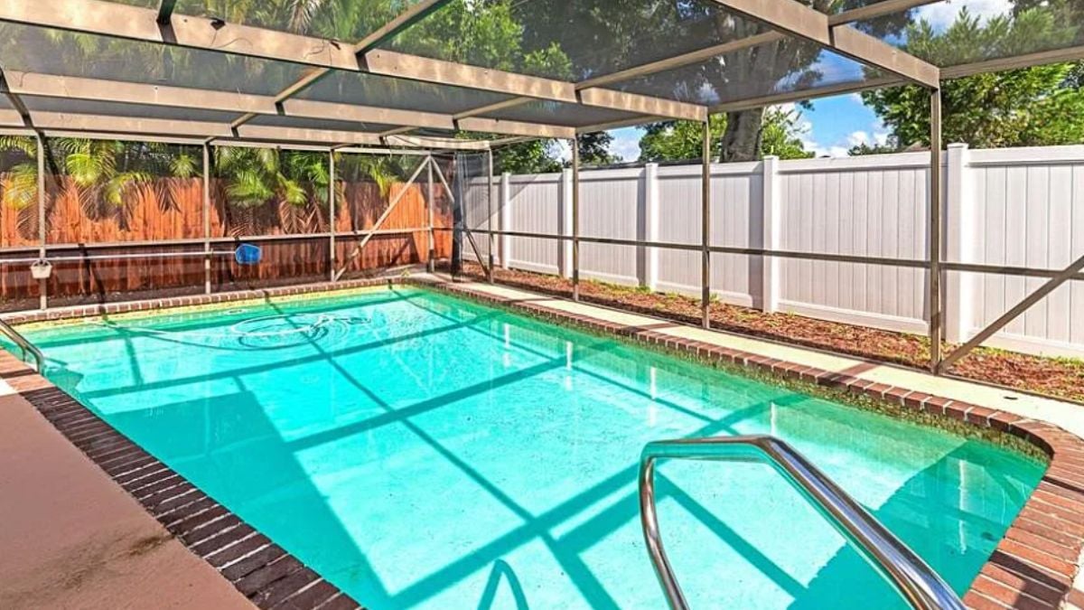 A screen-covered swimming pool.