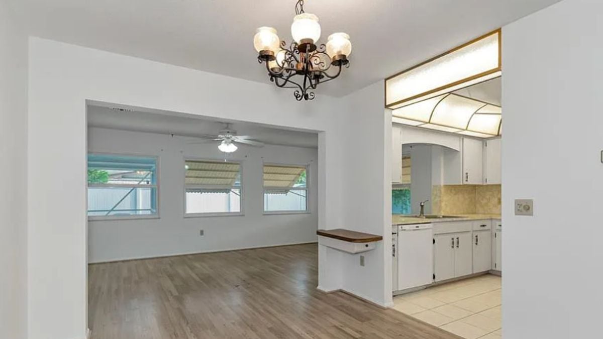A dining room with a chandelier.