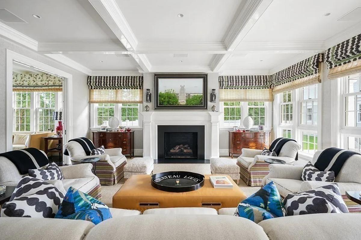 Living room with couches and a fireplace.