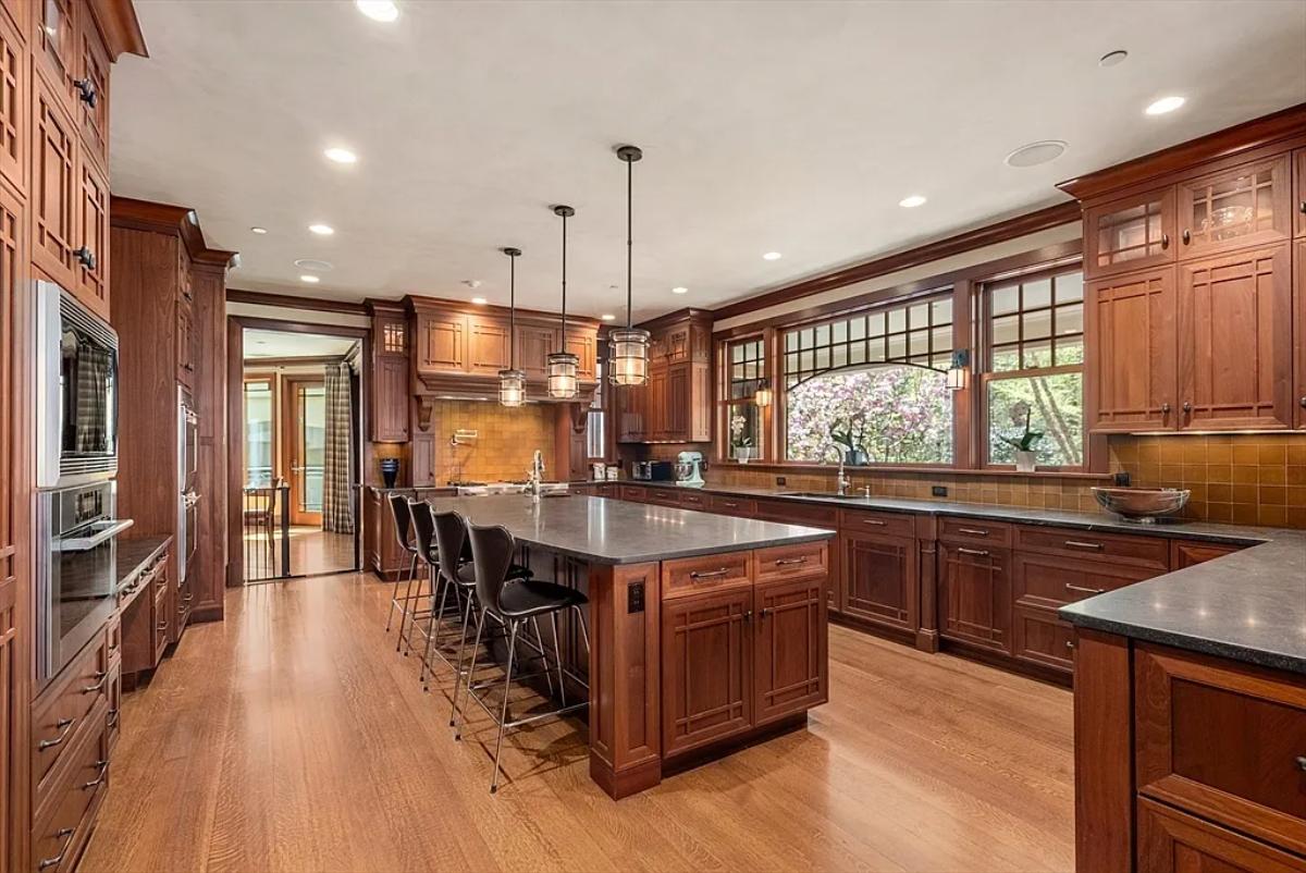 Kitchen with custom cabinetry and a counter breakfast bar.
