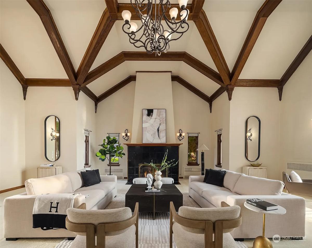 Living room with couches and a fireplace.