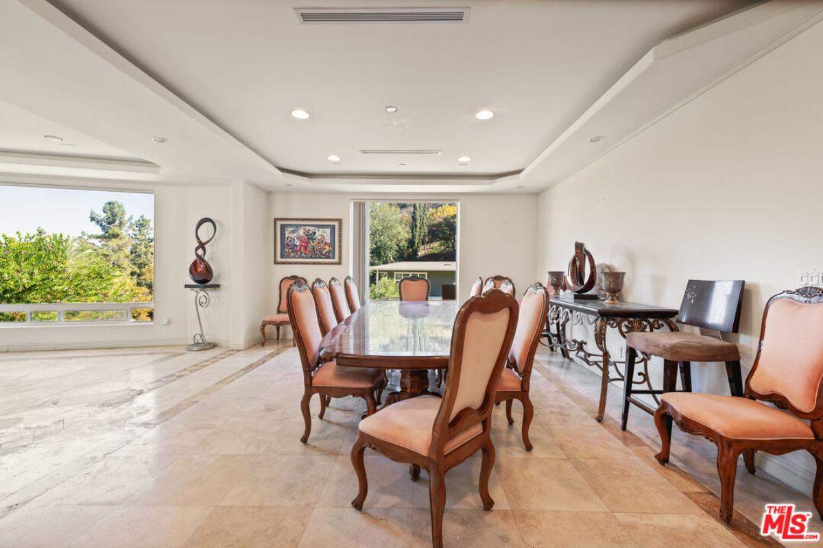 Dining room with a large table and chairs.