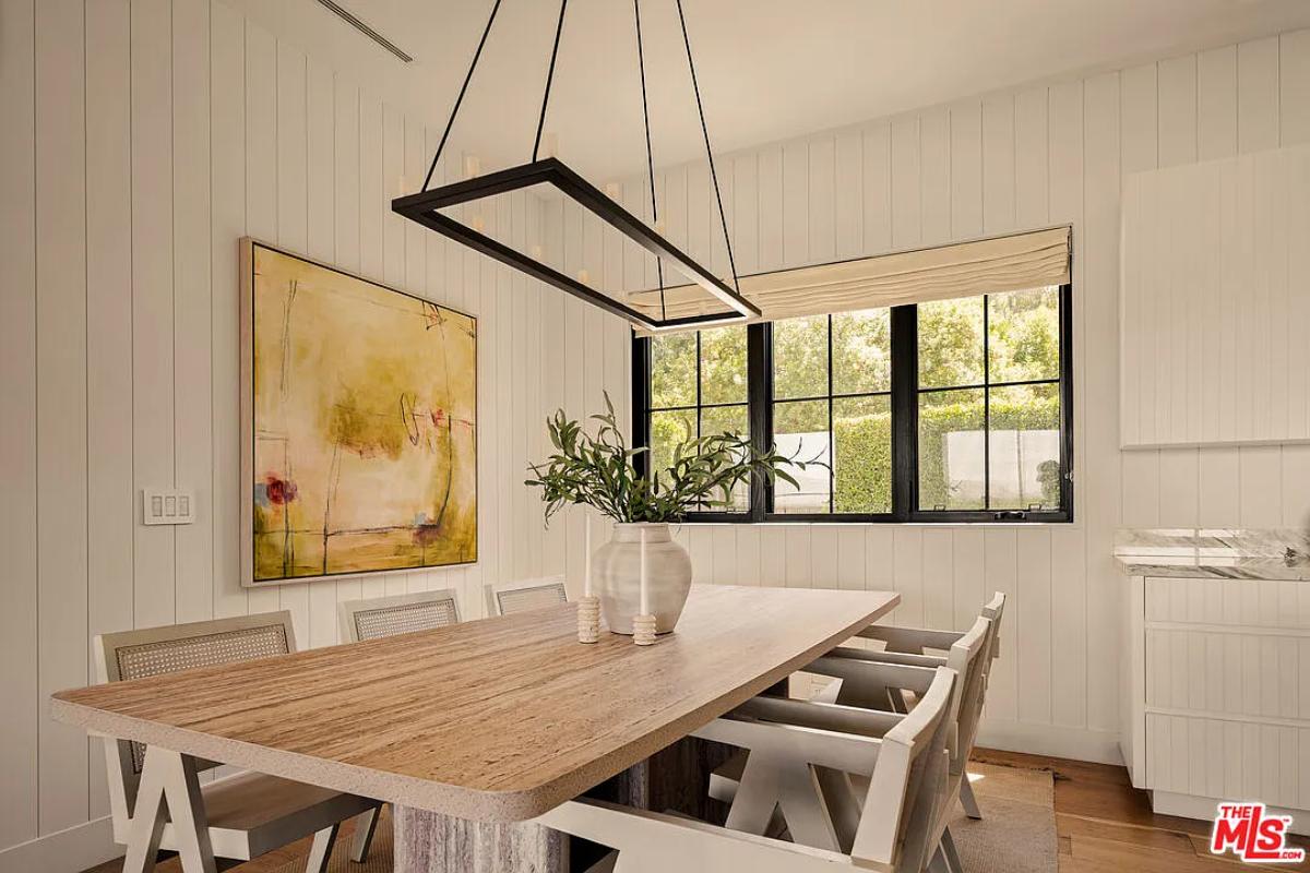 Dining room with a large wood table.