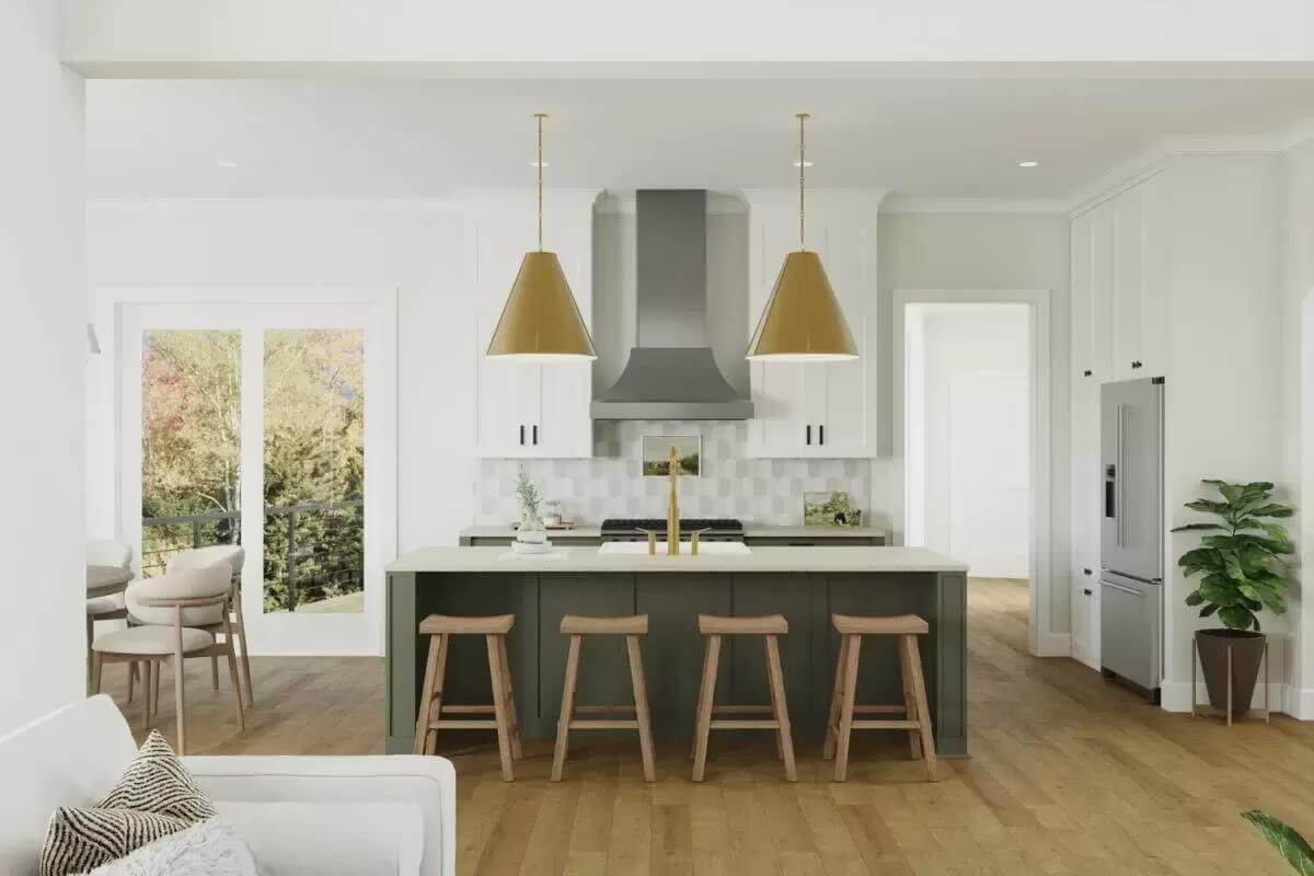 Kitchen with white cabinetry, modern appliances, and a breakfast island with seating for four.