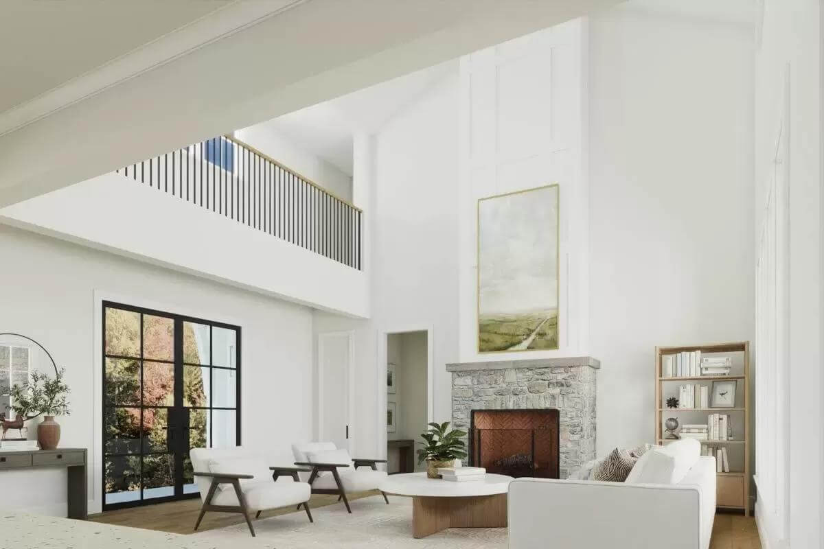 The living room includes a tall vaulted ceiling and a view of the balcony.