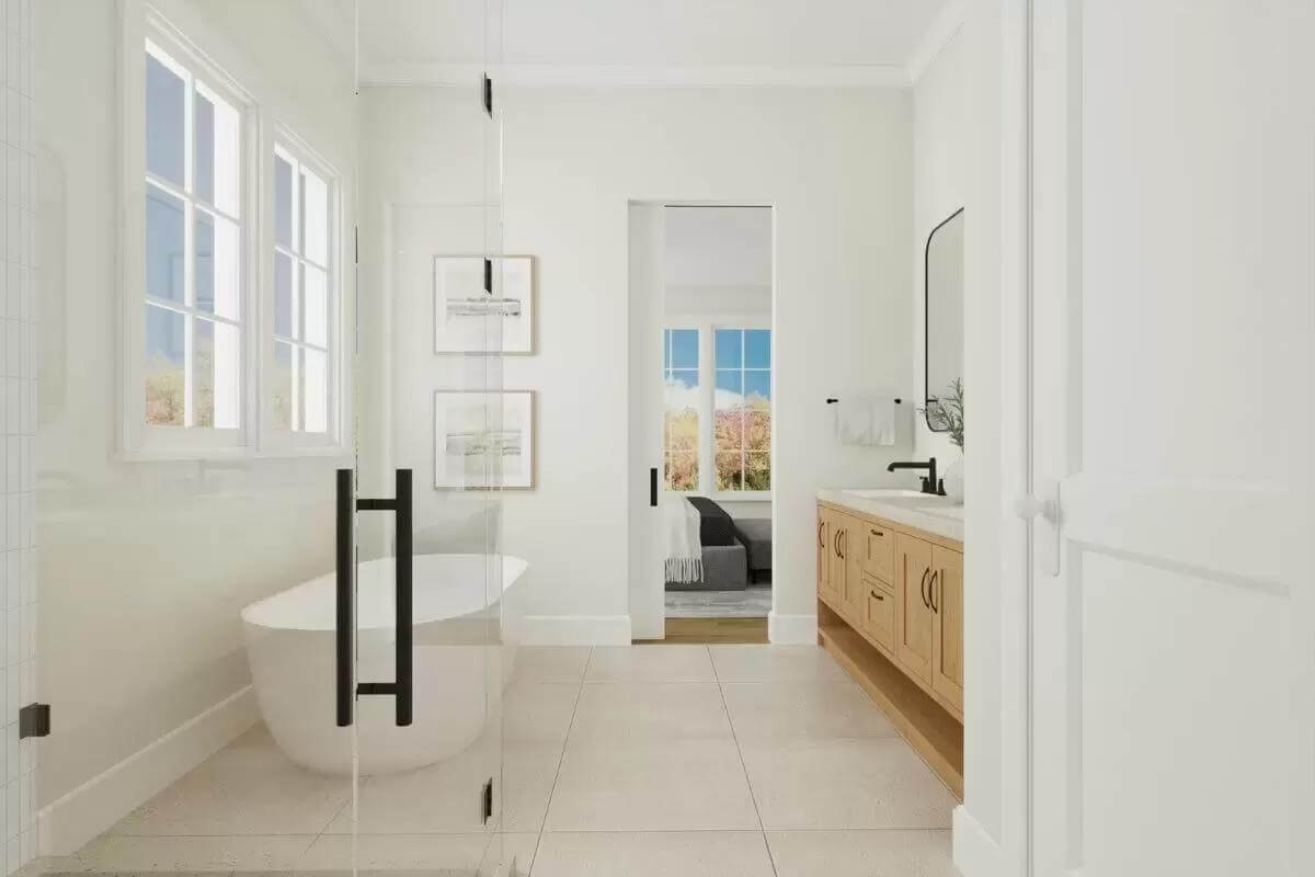 Primary bathroom with a dual sink vanity, a glass-enclosed shower, and a soaking tub.