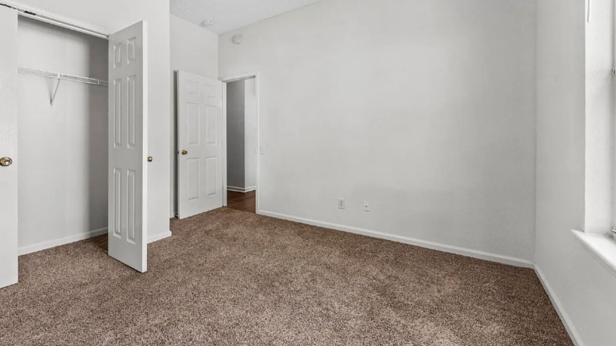 A bedroom with a window.