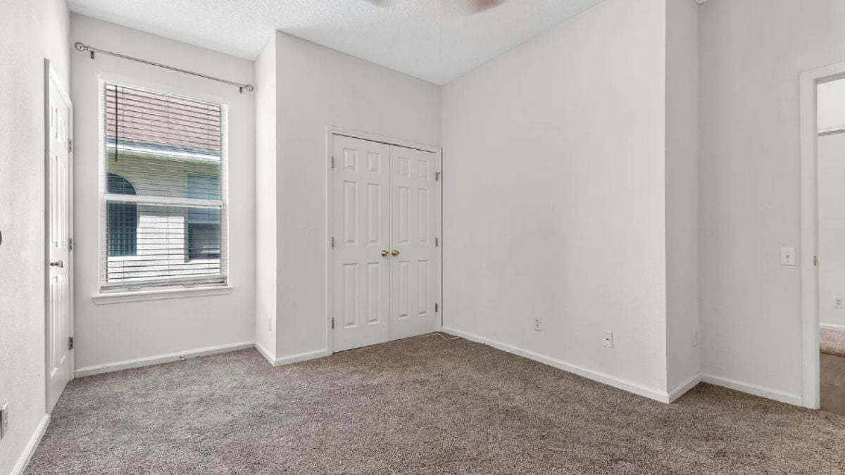 A bedroom with a window.