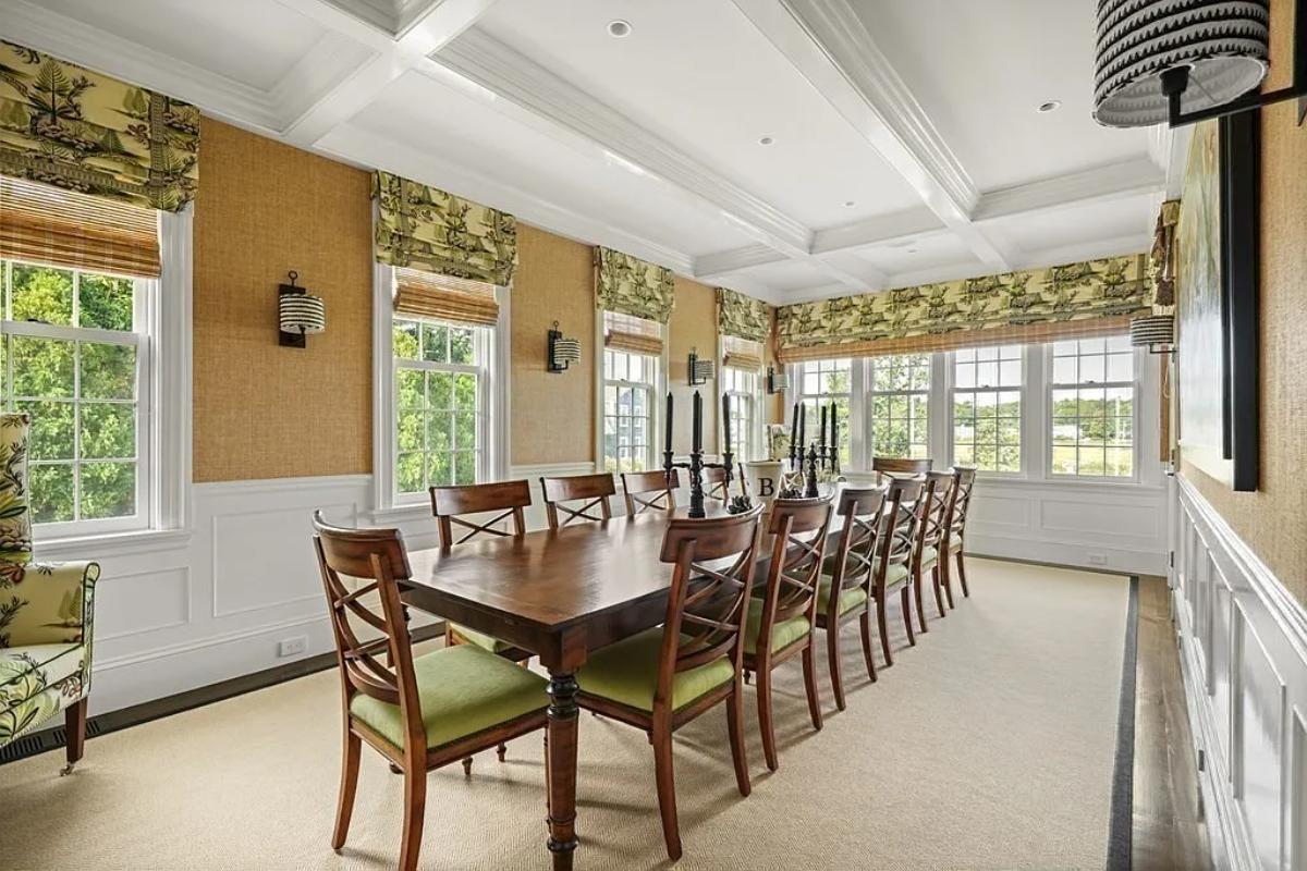 Dining room with a large wood table.