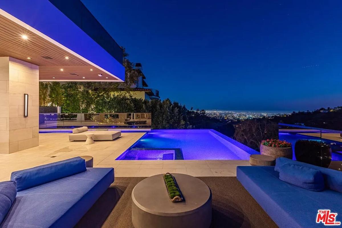 Outdoor living space adjacent to the pool.
