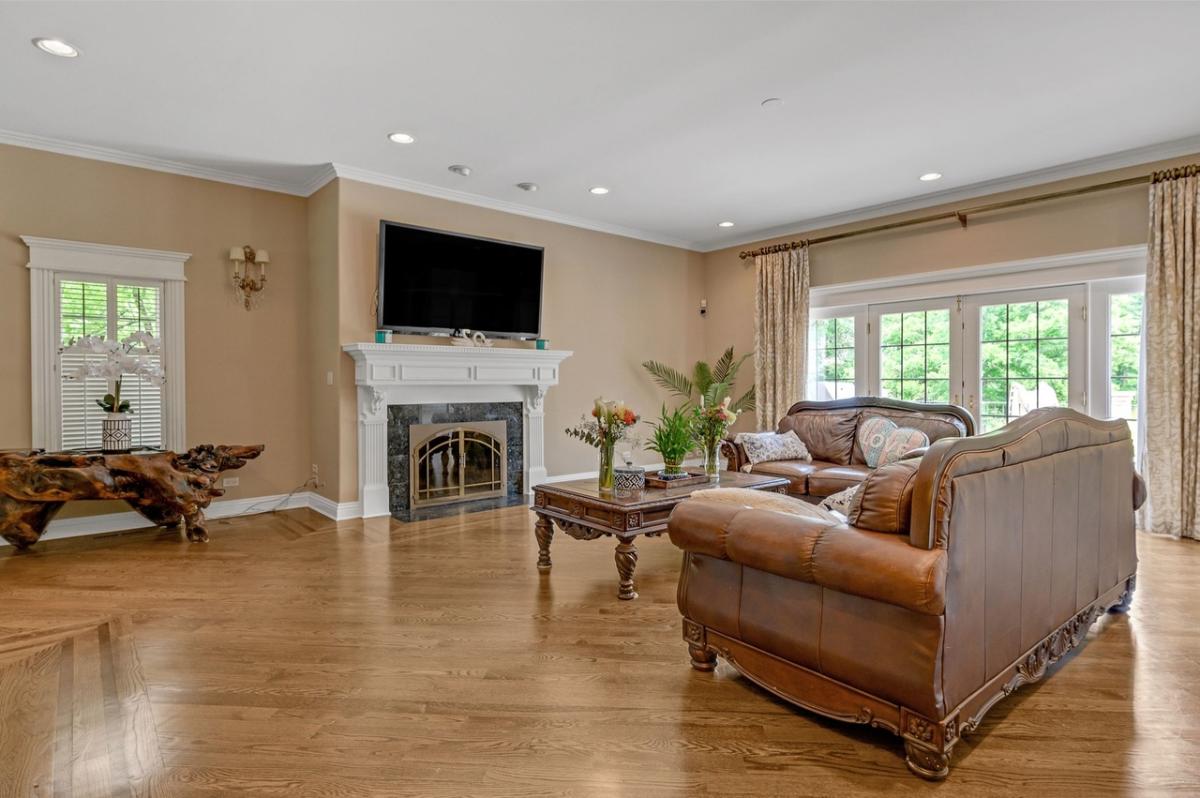 Living room with couches and a fireplace.