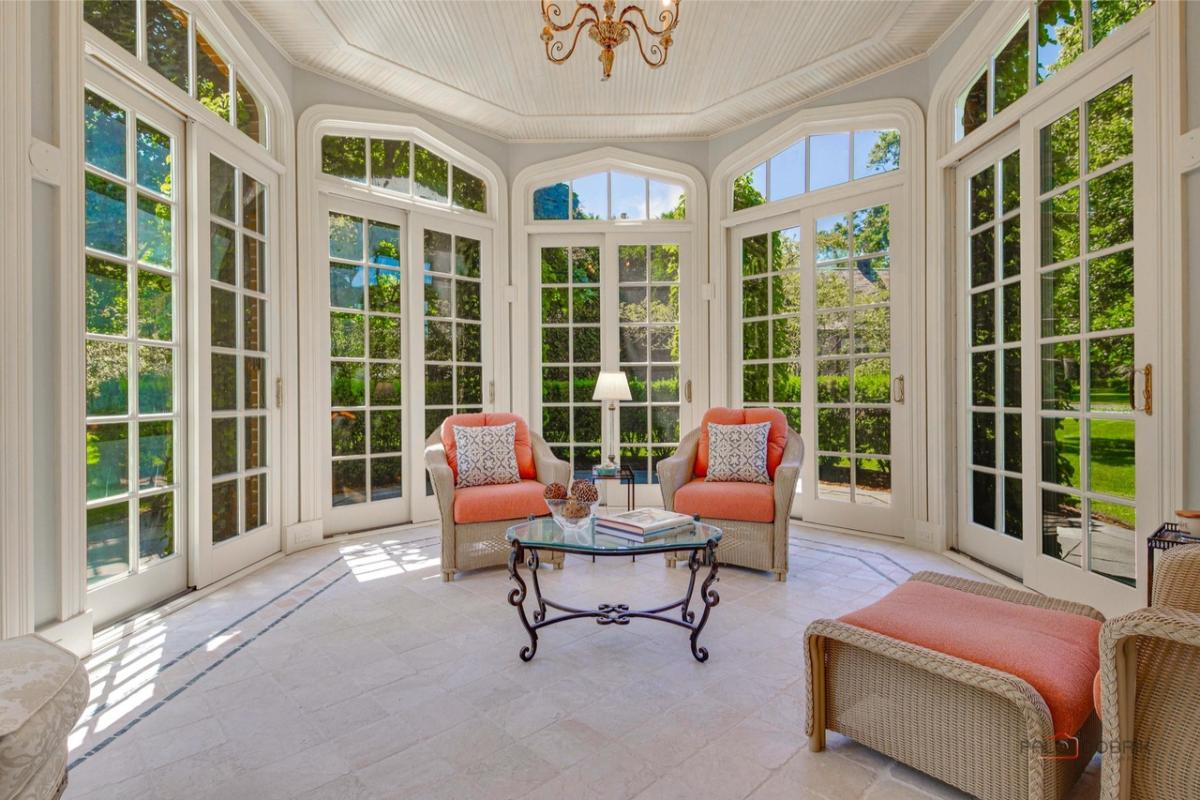 Sunroom with glass windows.