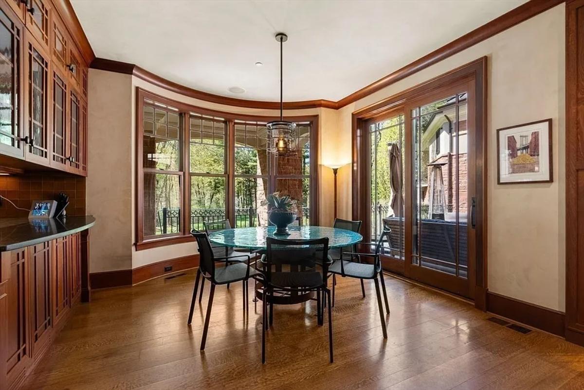 Breakfast nook with a round glass table.