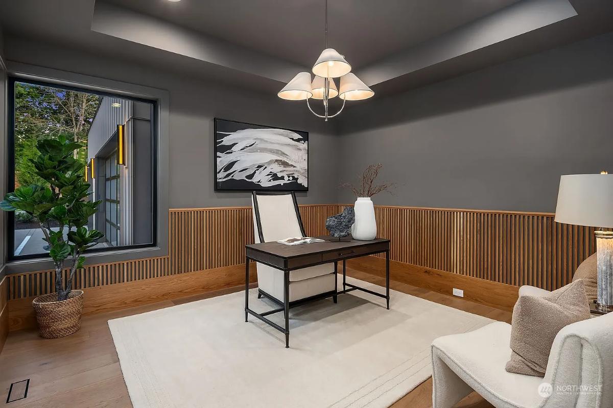 Home office with hardwood floors.