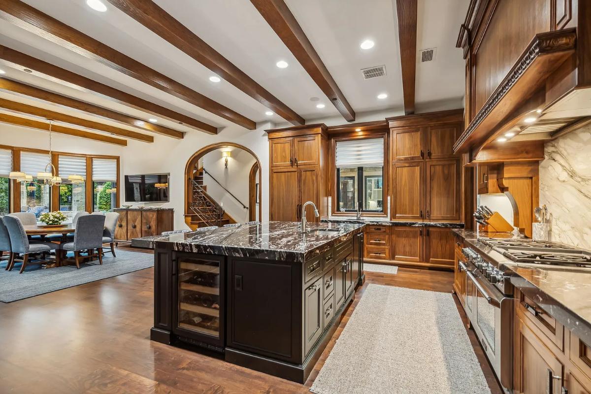 Kitchen with custom cabinetry and an island prep area.