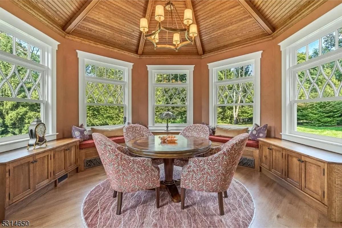 Breakfast nook with a round wood table.