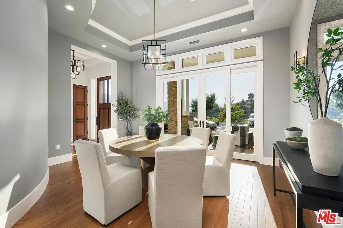 Dining room with a round wood table.
