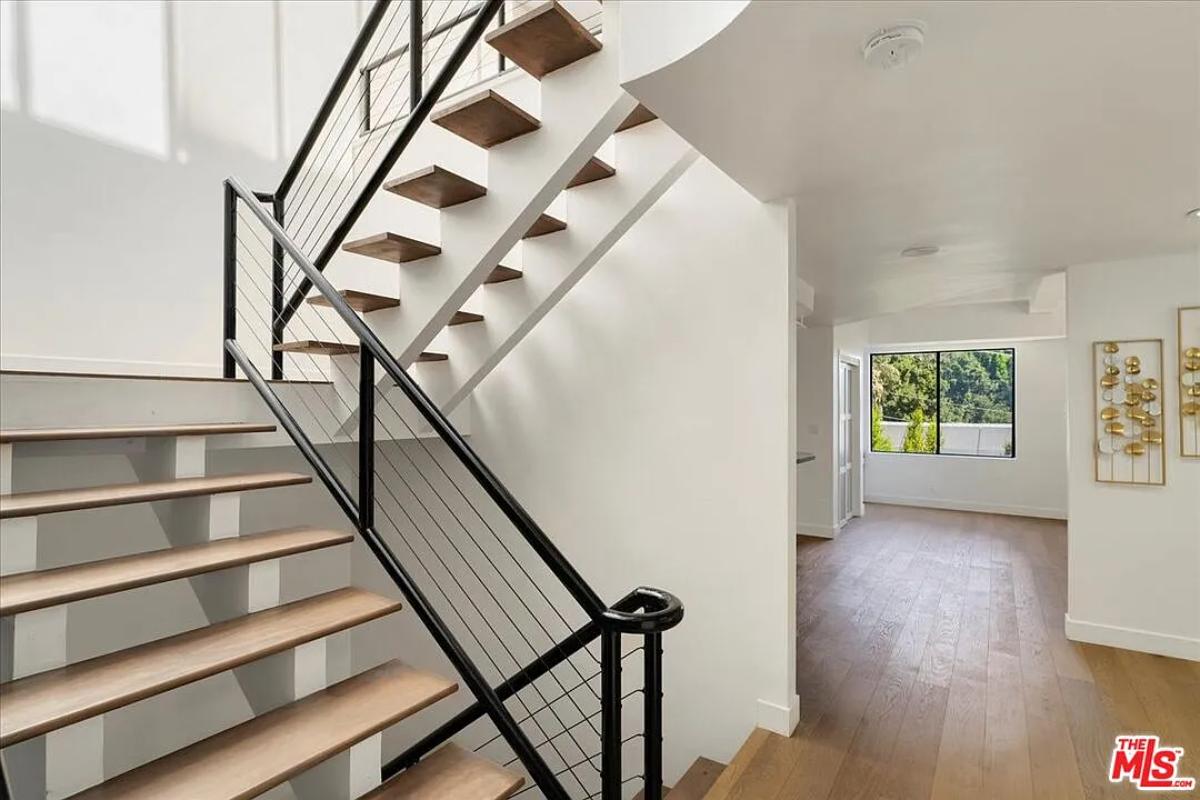 Stairs with metal railings.