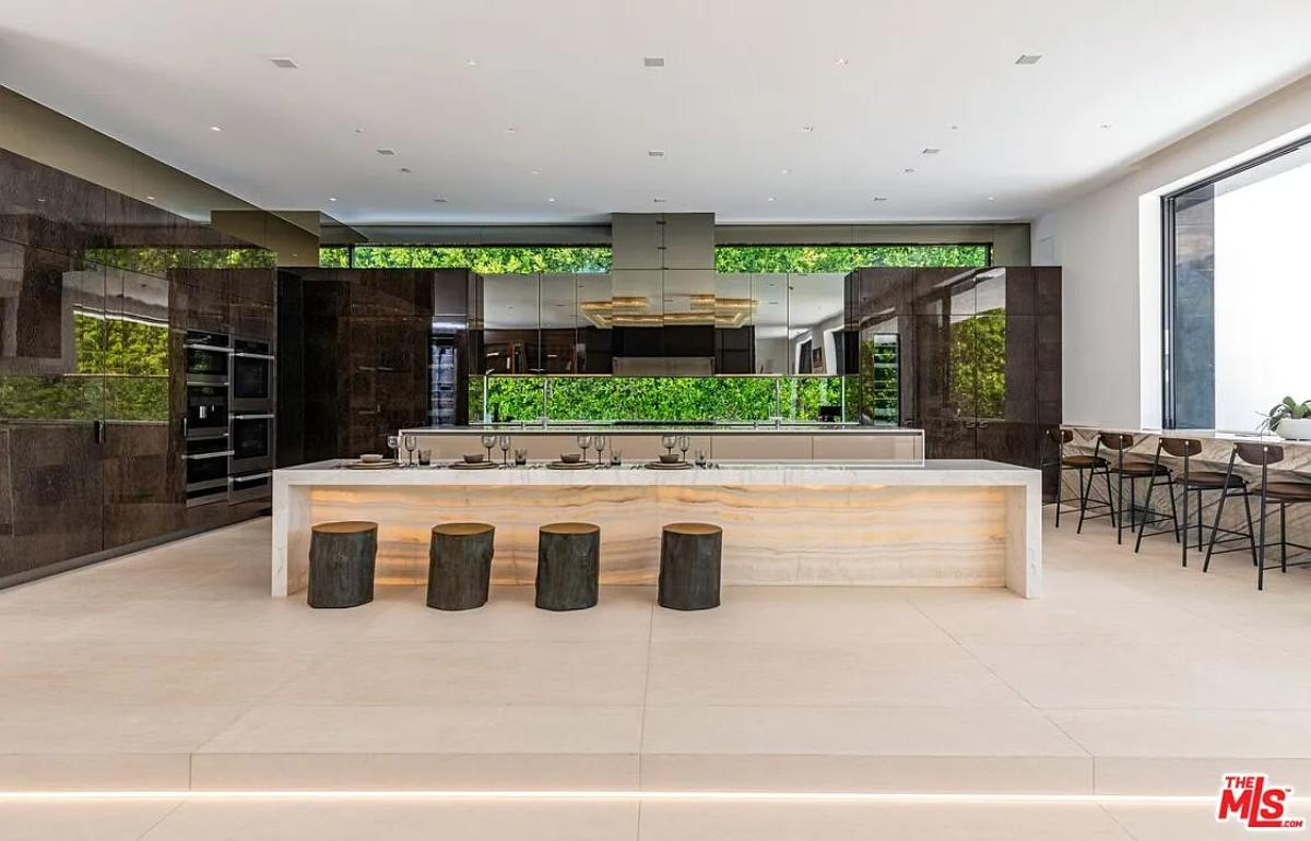Kitchen with custom cabinetry and a counter breakfast bar.