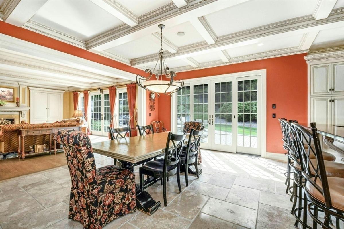 Breakfast nook with a large wood table.
