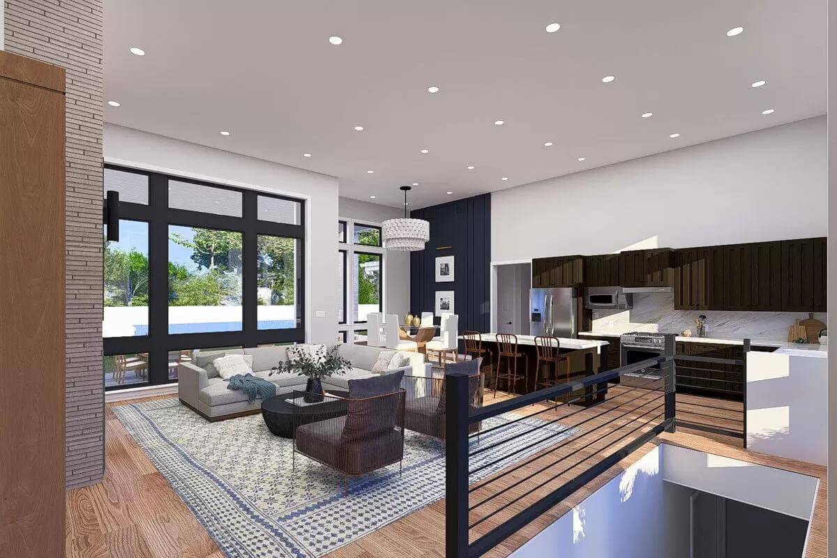 An open layout view of the living room, dining area, and kitchen from the foyer.
