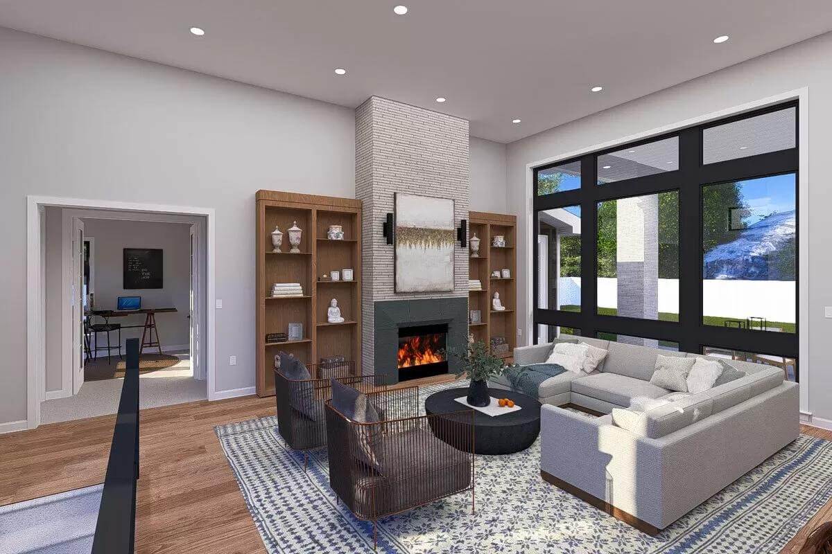Living room with a sectional sofa, cushioned chairs, and a fireplace flanked by wooden built-ins.