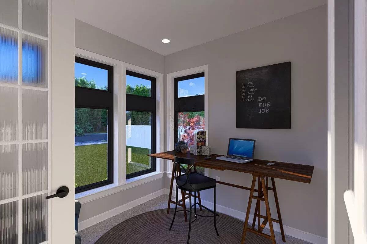 Office with a dark wood desk and black-framed windows.