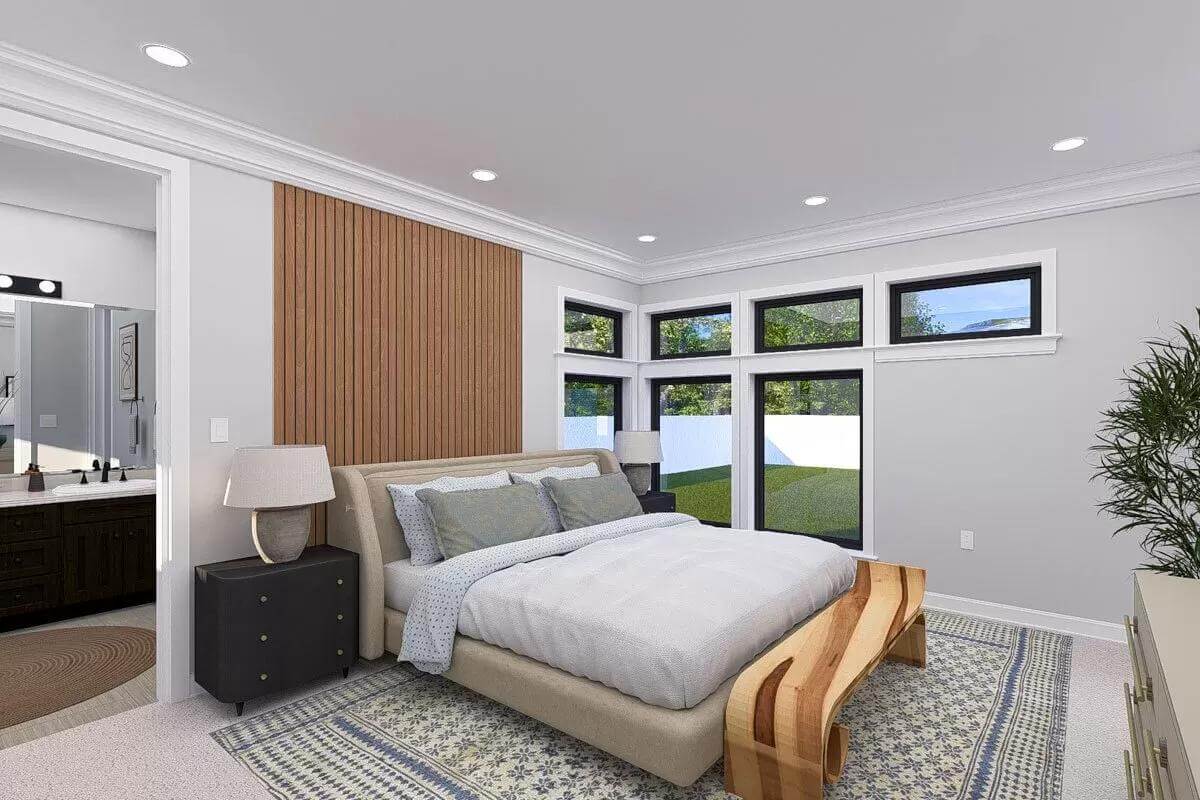 Primary bedroom with an upholstered bed and a unique bench over the area rug.