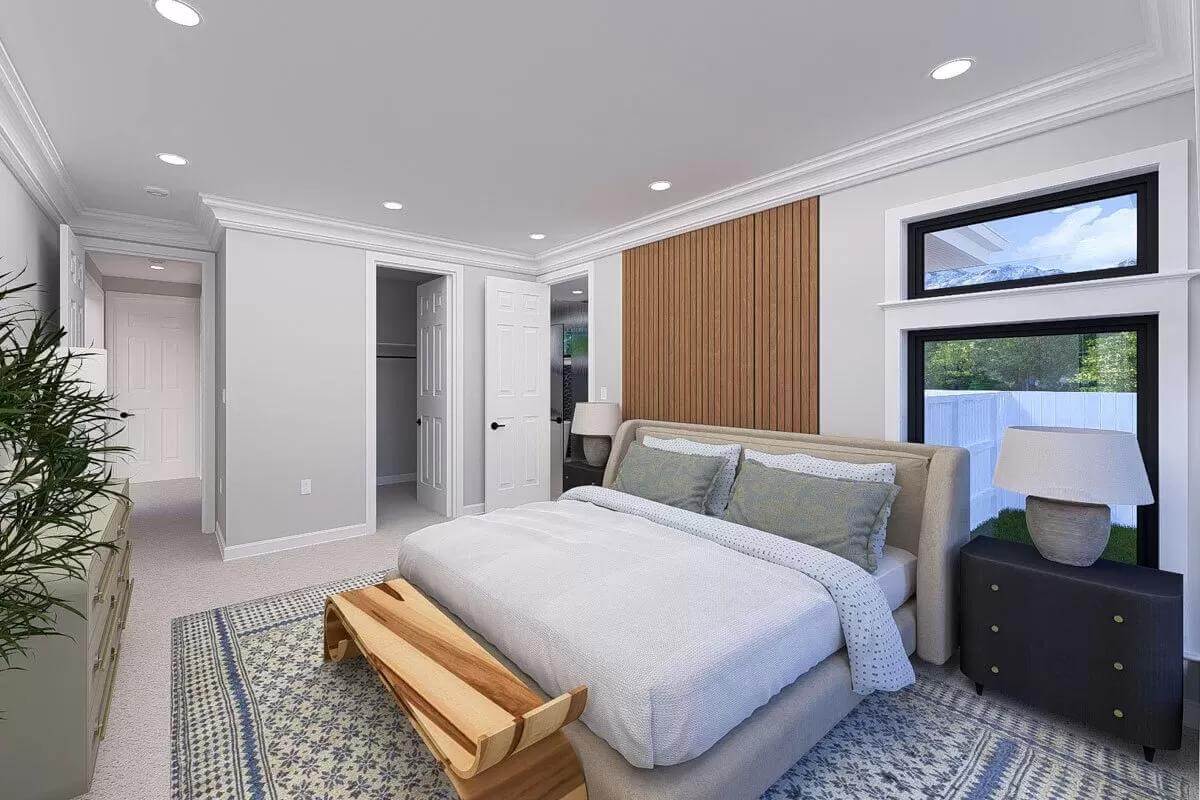 The primary bedroom includes an ensuite full bath and a carpeted floor.