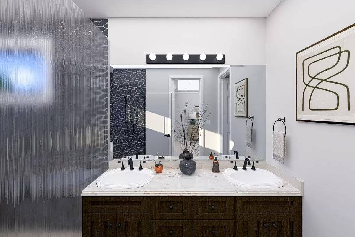 Primary bathroom with a dual sink vanity and a walk-in shower.