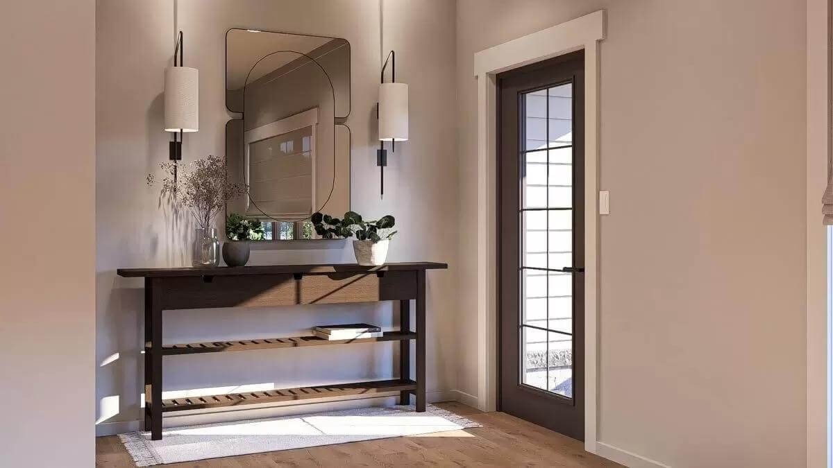 Foyer with a dark wood console table and a glazed front door.