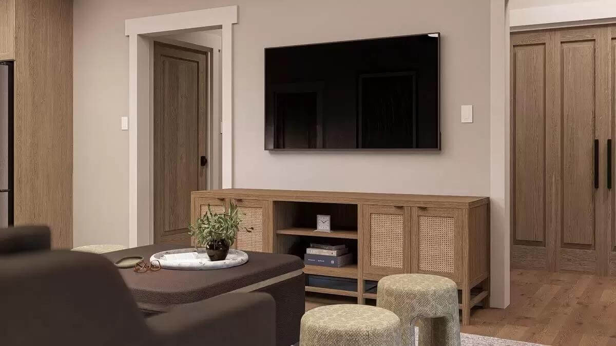 Family room showcasing the TV fixed above the wooden console table.