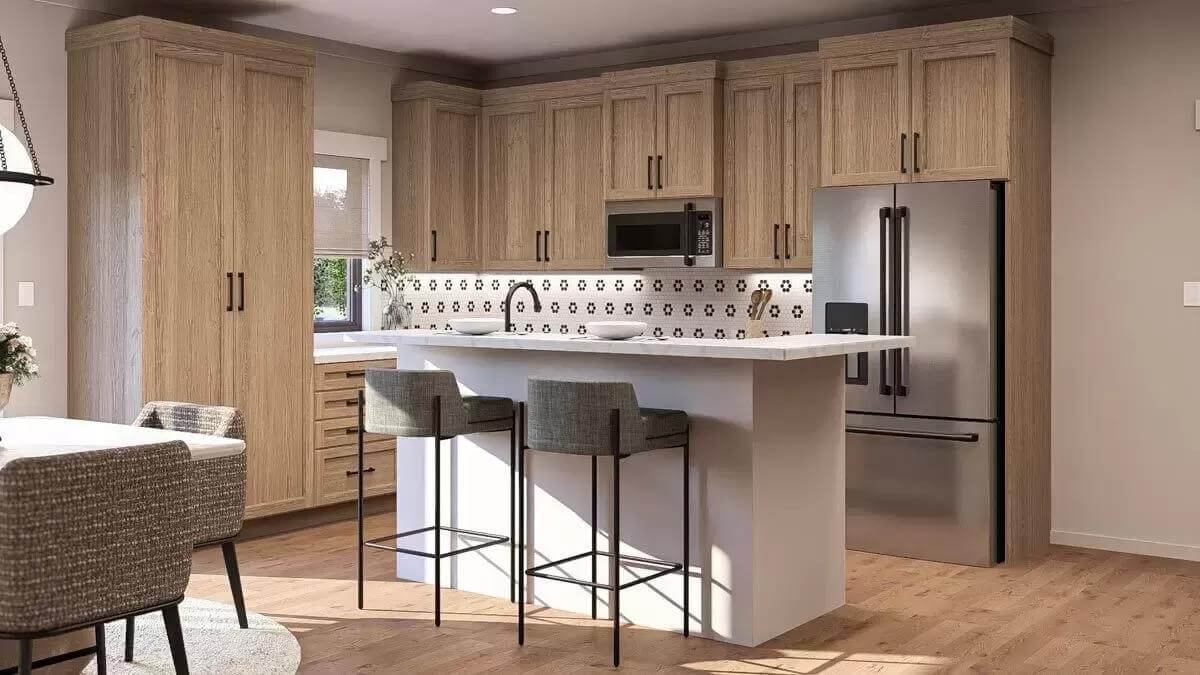 Kitchen with wooden cabinets, slate appliances, and a breakfast bar.