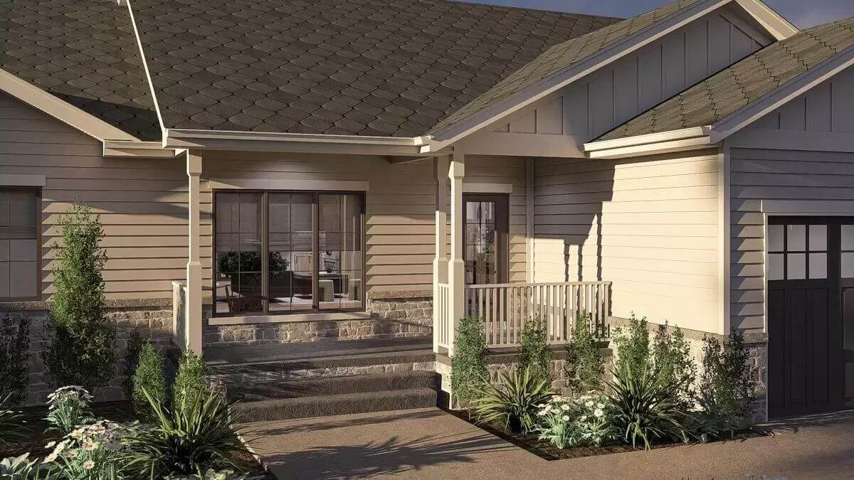 Entry porch with white pillars, a concrete stoop, and a glazed front door.