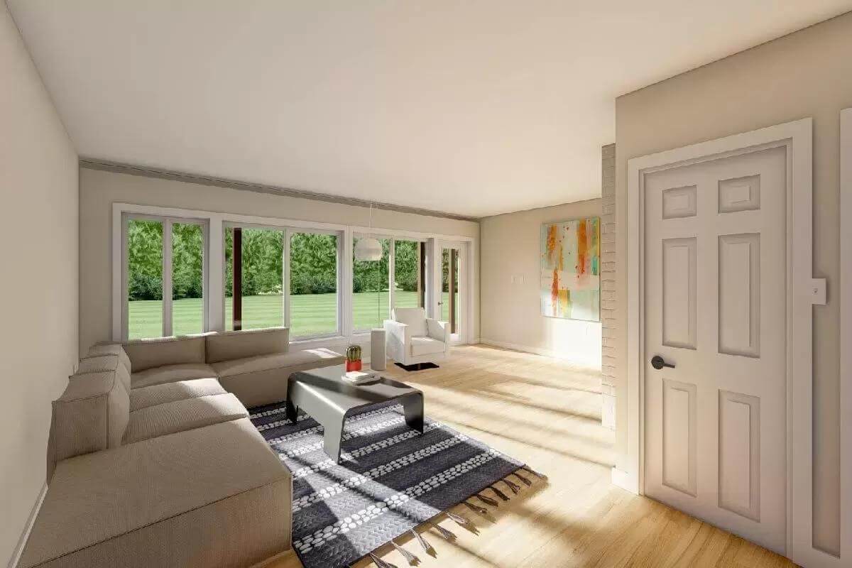 Recreation room with an L-shaped sectional, a storage closet, and outdoor access via a glazed door.