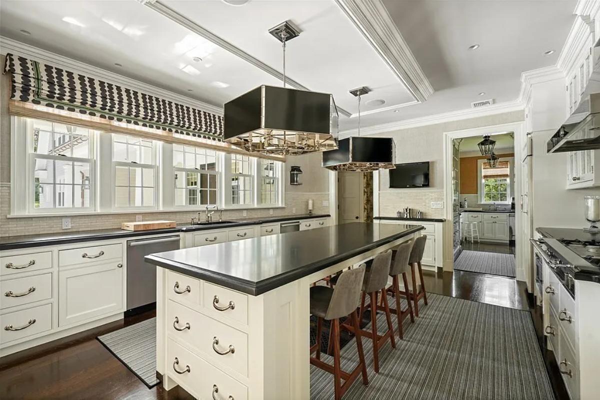 Kitchen with custom cabinetry and a counter breakfast bar.