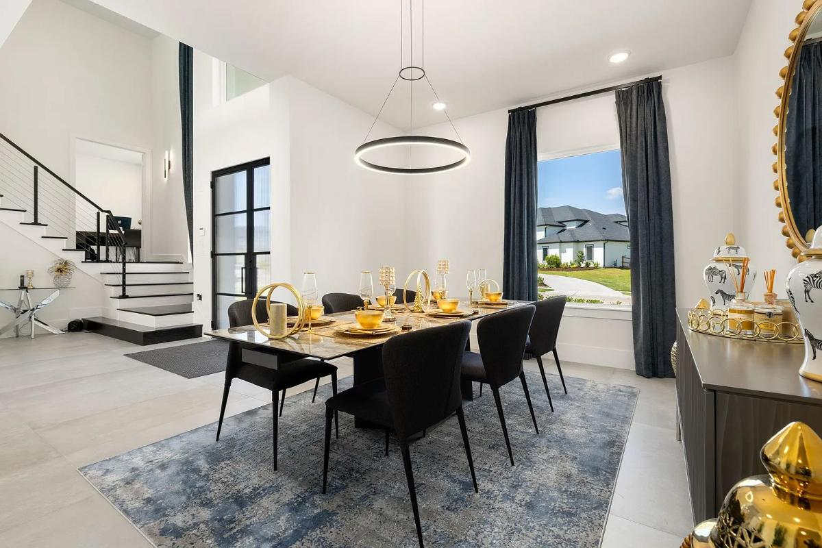 Dining room with a large table and chairs.