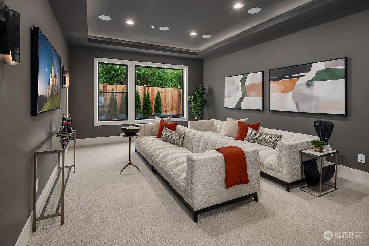 Home theater with carpet flooring.