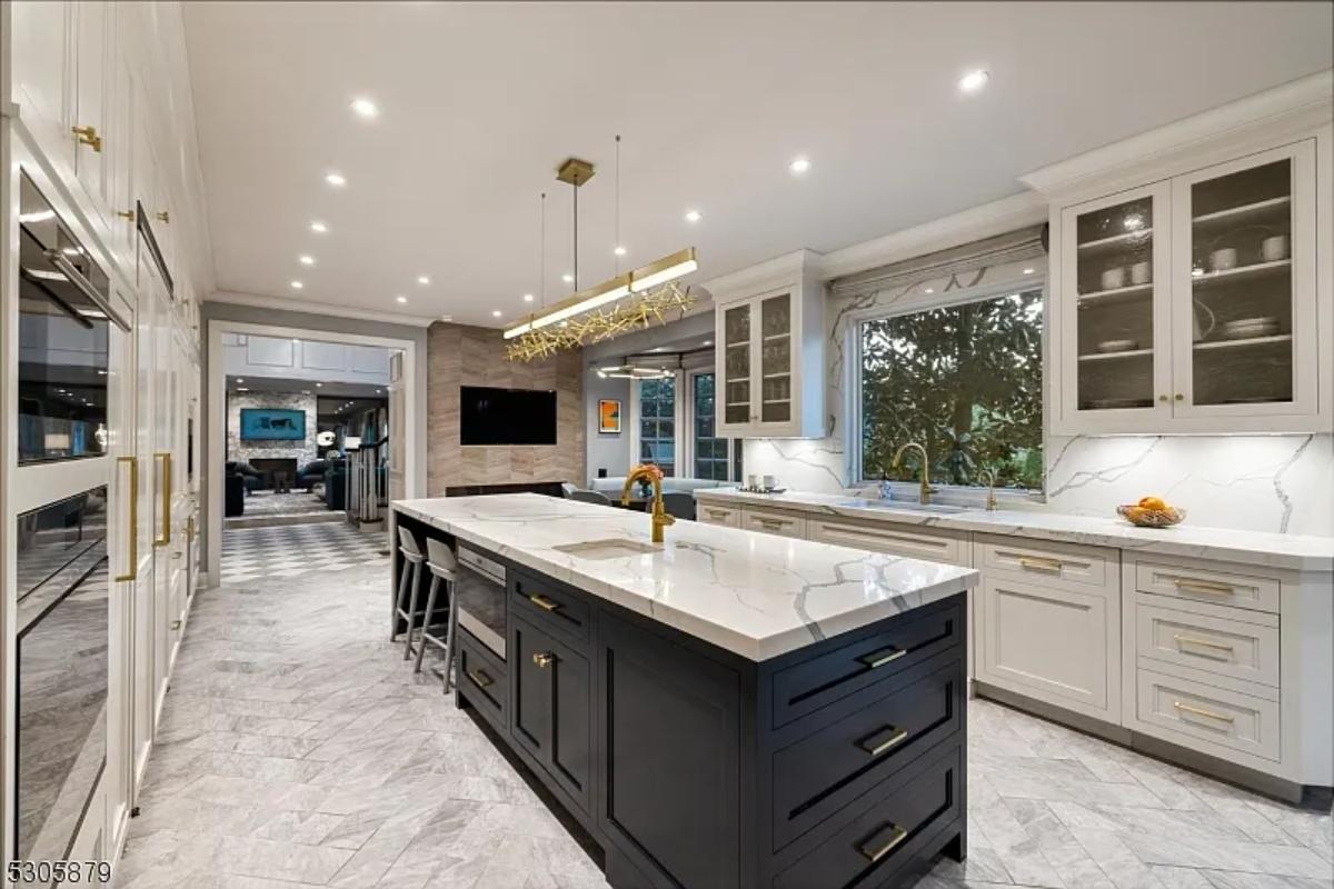 Kitchen with custom cabinetry and a center island prep area.