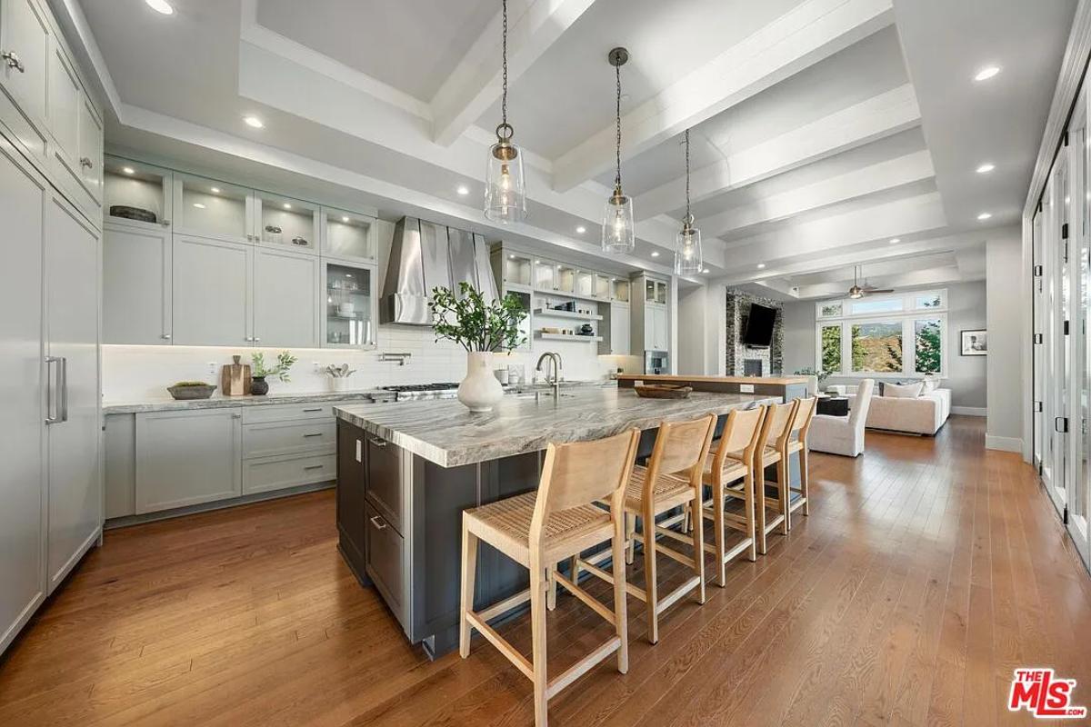 Kitchen with custom cabinetry and a counter breakfast bar.