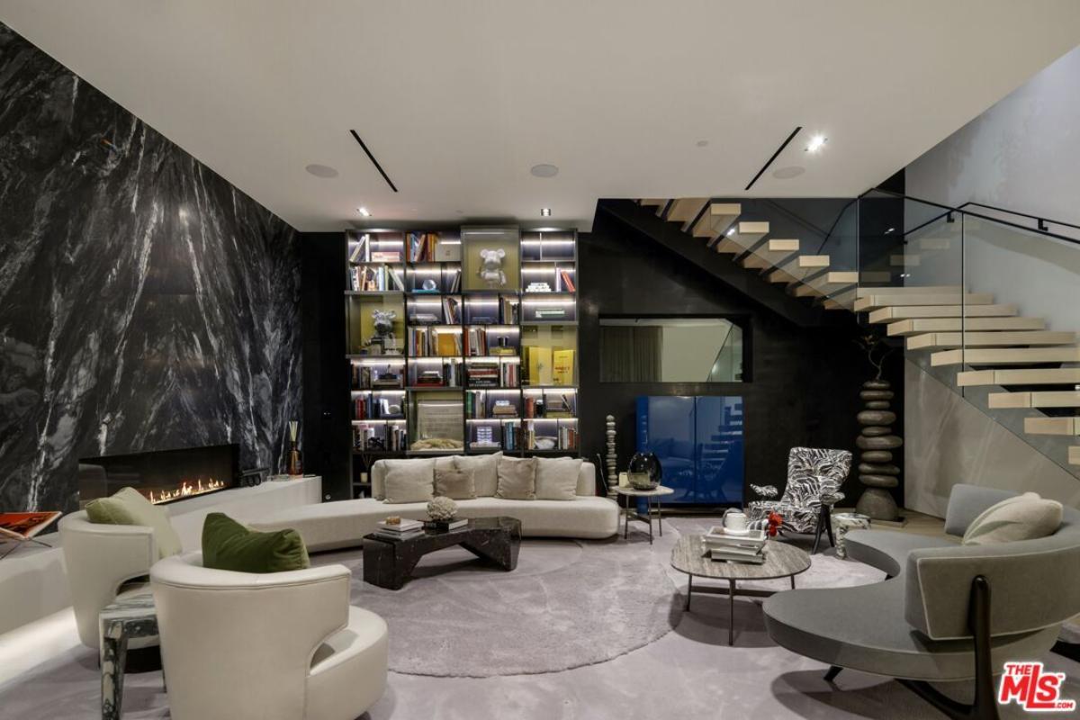 Living room with couches and a fireplace.