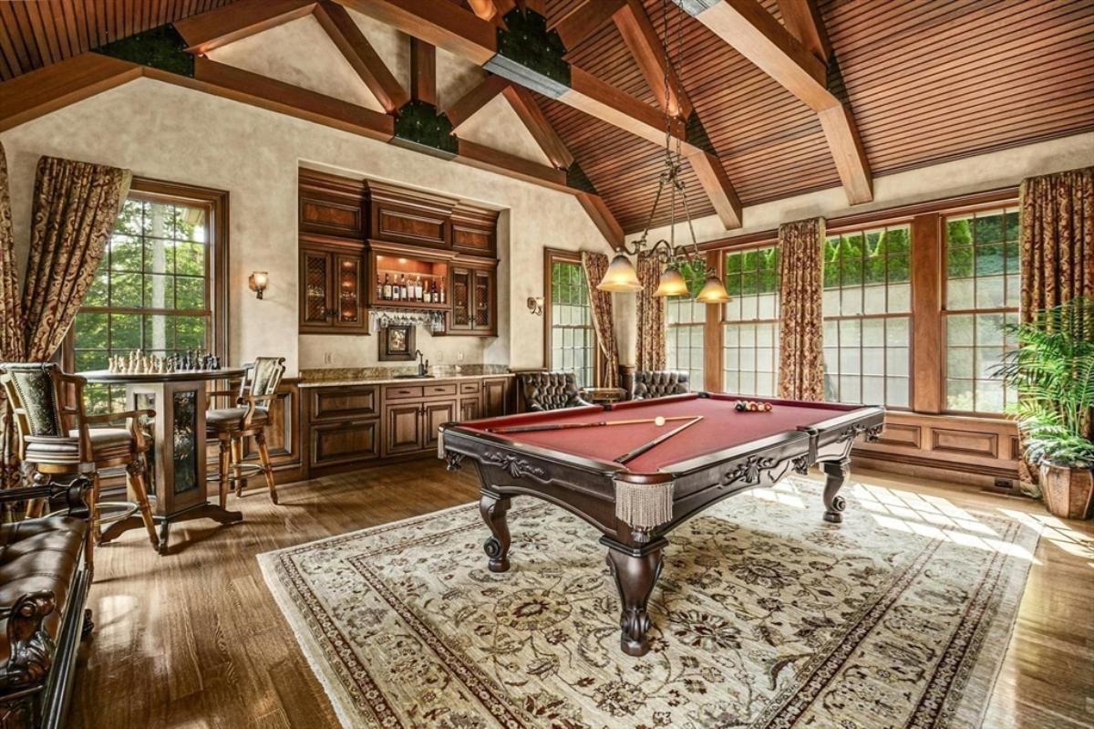 Recreation room with a billiards table.