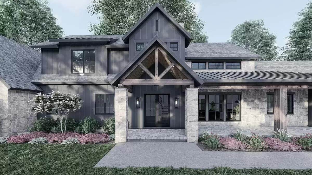 Entry porch with a French front door and a gable roof supported by stone columns.