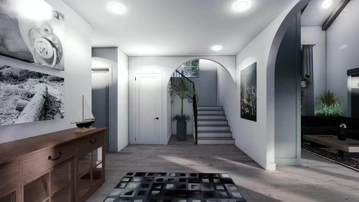 Foyer with a wooden console table, a checkered rug, and arched openings.