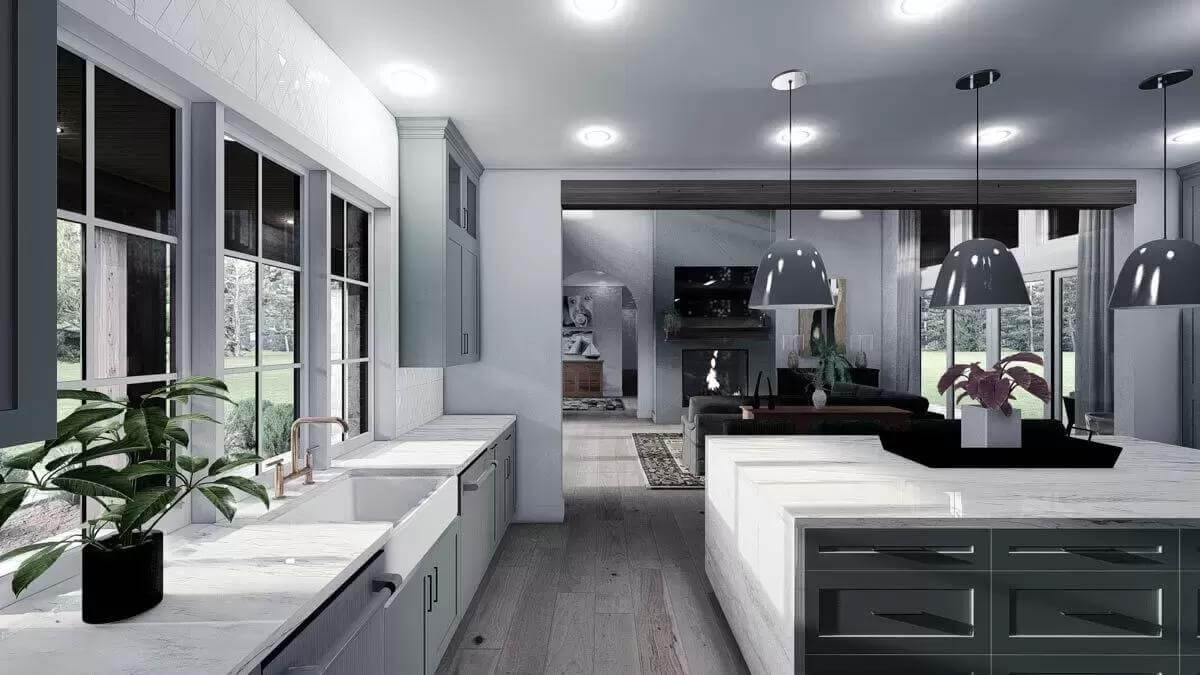 The kitchen includes marble countertops and a farmhouse sink set under the framed windows.